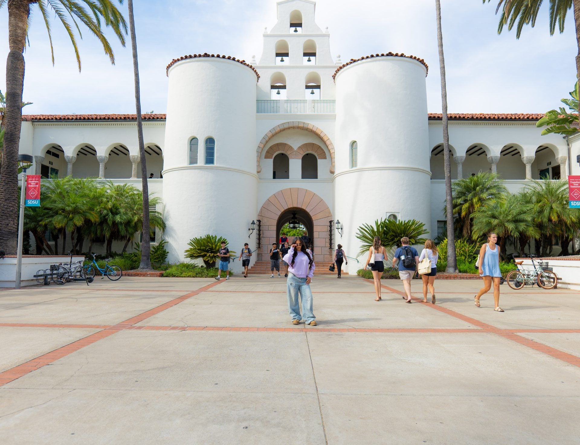 Wide view of a Spanish Revival campus building in California, Wilomina worn in the courtyard